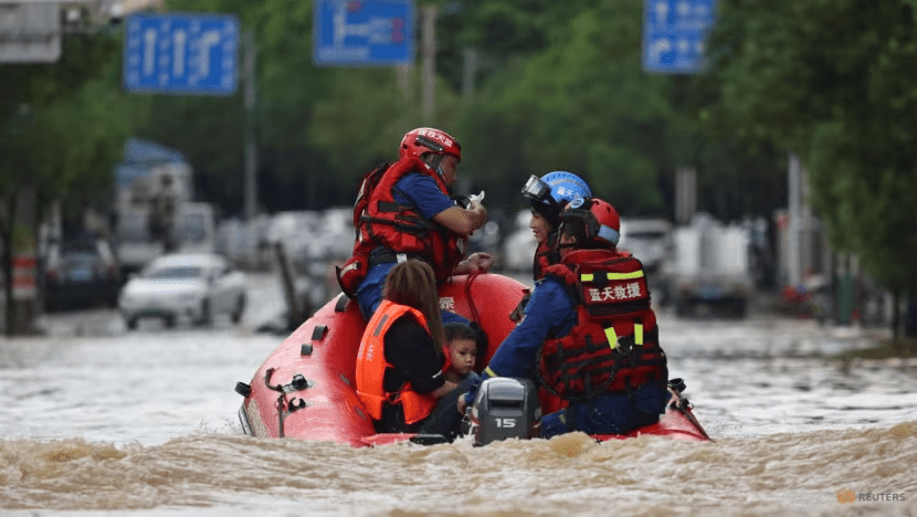 Rescue workers evacuate residents stranded by floodwaters with a boat, following heavy rainfall in Huaiji county of Zhaoqing, Guangdong province, China on Jun 18, 2025. (Photo: Reuters/China Daily)