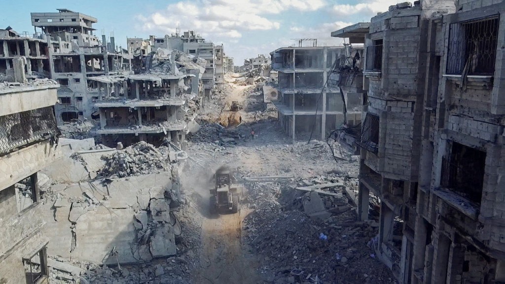 A drone view shows heavy machinery operating around a destroyed residential neighbourhood, following the withdrawal of the Israeli forces from the area, amid a ceasefire between Israel and Hamas in Gaza, in Gaza City, October 18, 2025. (Reuters)