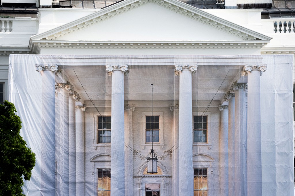 A tarp with a picture of the front of the White House covers construction scaffolding on the North Portico of the White House in Washington, D.C. U.S., July 11, 2026. (Reuters)
