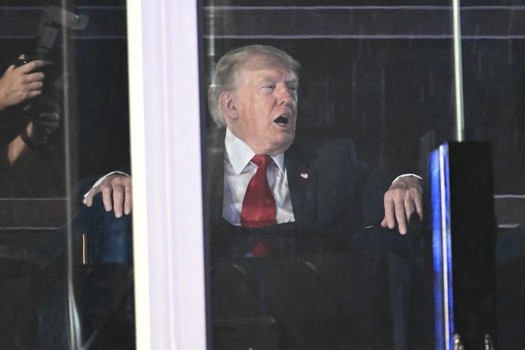Photo by KENT NISHIMURA / AFP  US President Donald Trump watches the fireworks display during the "Salute to America" Independence Day celebration on the National Mall in Washington, DC, in the early morning hours of July 5, 2026.