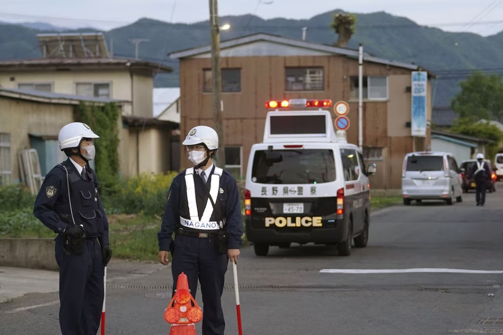 Police officers stand near the scene of a stabbing and shooting incident in Nakano, Nagano Prefecture, Japan, in this photo taken by Kyodo on May 25, 2023. Mandatory credit Kyodo via REUTERS 