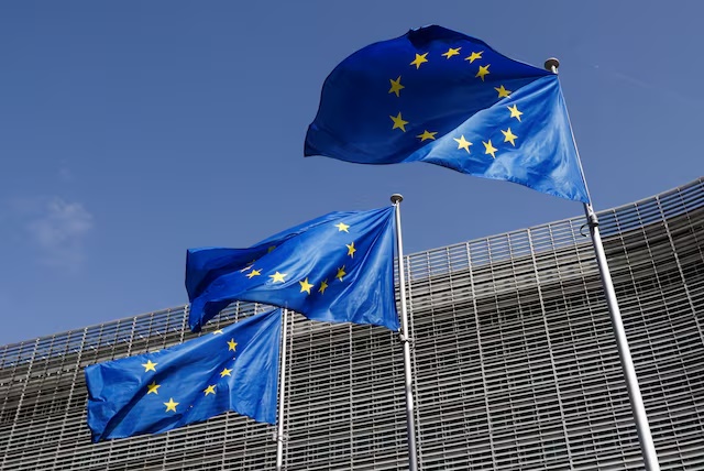 European Union flags flutter outside the EU Commission headquarters in Brussels, Belgium June 17, 2022. REUTERS/Yves Herman/File Photo