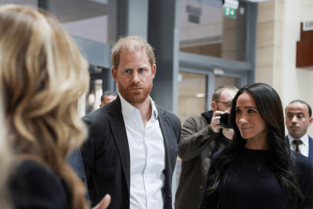 Britain's Prince Harry and Meghan, the Duchess of Sussex, listen as they visit the King Hussein Cancer Center accompanied by a delegation from the World Health Organization in Amman, Jordan, February 26, 2026. REUTERS/Alaa Al Sukhni