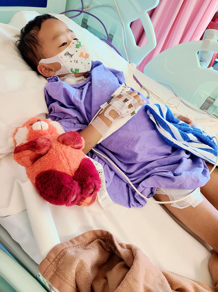 Kansas laying in bed with his stuffed toy. From Facebook