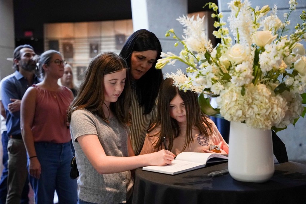 People gather at the Country Music Hall of Fame after it was announced that country music icon Dolly Parton died aged 80. Reuters