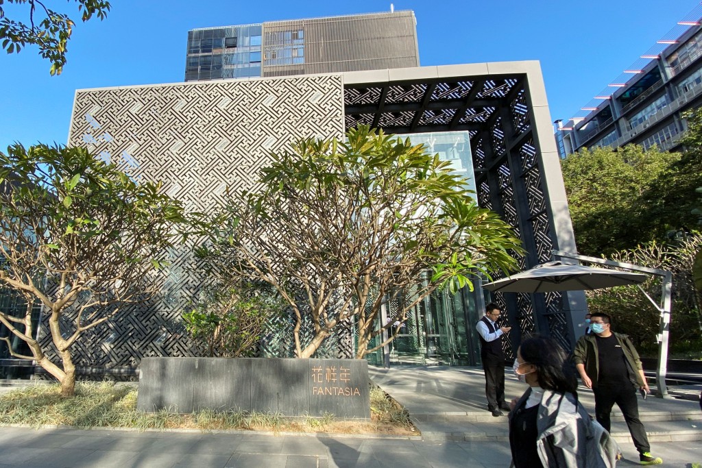 People stand outside the headquarters of Chinese developer Fantasia Holdings (1777) in Shenzhen, Guangdong province, China Novem