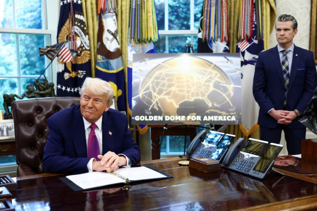U.S. President Donald Trump makes an announcement regarding the Golden Dome missile defense shield next to U.S. Defense Secretary Pete Hegseth in the Oval Office of the White House in Washington, D.C., U.S., May 20, 2025. REUTERS/Kevin Lamarque