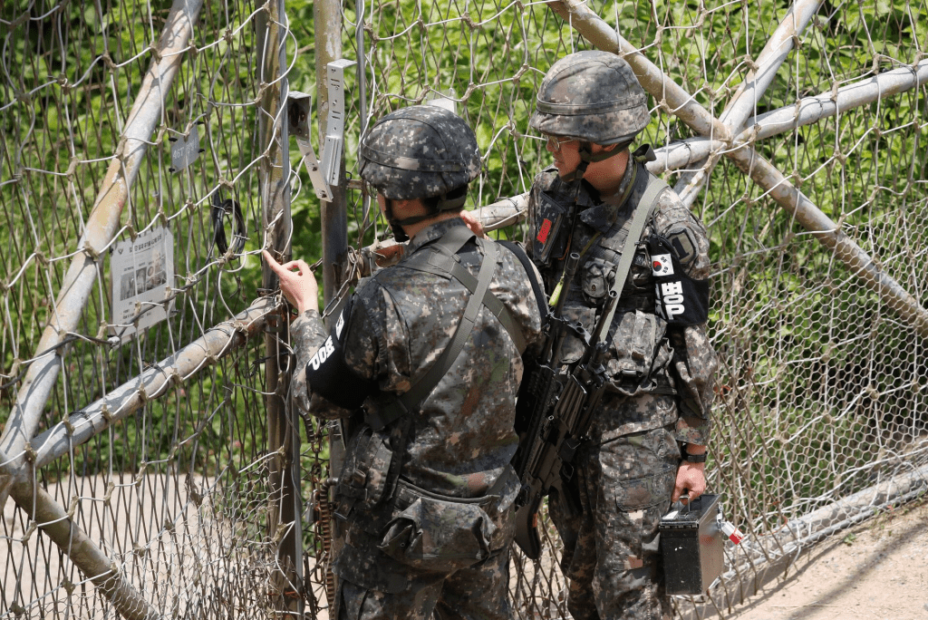 South Korean soldiers lock a gate at a guard post near the the demilitarized zone (DMZ) separating the two Koreas, in Paju, South Korea, June 17, 2020. REUTERS/Kim Hong-Ji