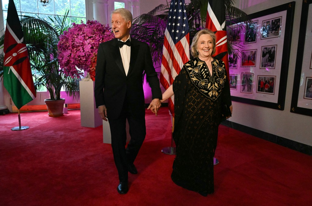 (FILES) Bill Clinton, 42nd US President and his wife Hillary Rodham Clinton, 67th US Secretary of State, arrive at the Booksellers Room of the White House on the occasion of the State Dinner with the Kenyan president at the White House in Washington, DC, on May 23, 2024.(Photo by SAUL LOEB / AFP)