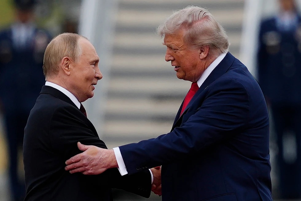 U.S. President Donald Trump greets Russian President Vladimir Putin, Aug. 15, 2025, at Joint Base Elmendorf-Richardson, Alaska. (AP Photo/Julia Demaree Nikhinson, File)