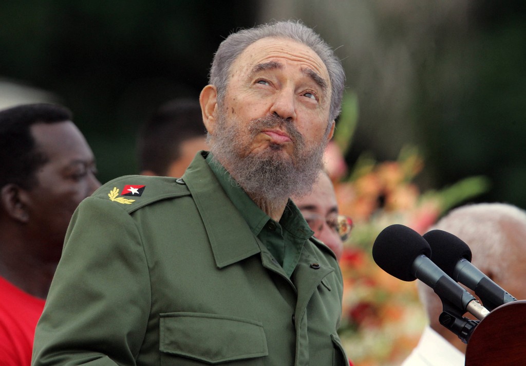 Photo by ADALBERTO ROQUE / AFP Cuban President Fidel Castro checks the weather by looking at the sky, as he delivers a speech on July 26th, 2006, at the Plaza de la Patria square in Bayamo, in the province of Granma, during a ceremony marking the 53rd anniversary of the assault on the Moncada barracks by rebels led by Castro.