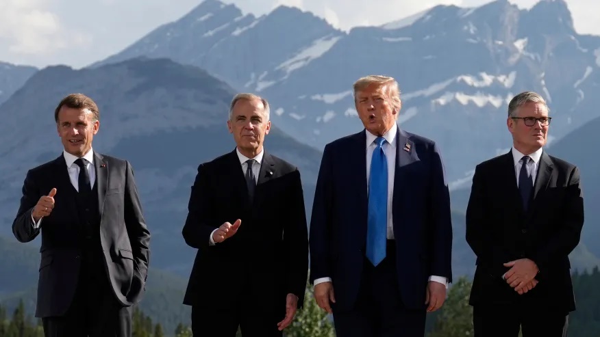 France’s President Emmanuel Macron, Canada’s Prime Minister Mark Carney, President Donald Trump and Britain’s Prime Minister Keir Starmer, arrive for a group photo at the G7 Summit, Monday, June 16, 2025, in Kananaskis, Canada. (AP Photo/Mark Schiefelbein)