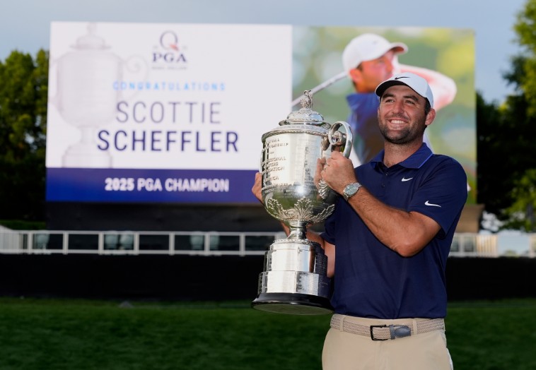 Scottie Scheffler poses with the Wanamaker trophy after winning the PGA Championship at Quail Hollow. AP