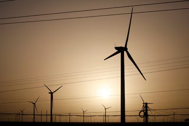 Wind turbines stand on a power station near Yumen, Gansu province, China September 25, 2020. REUTERS/Carlos Garcia Rawlins