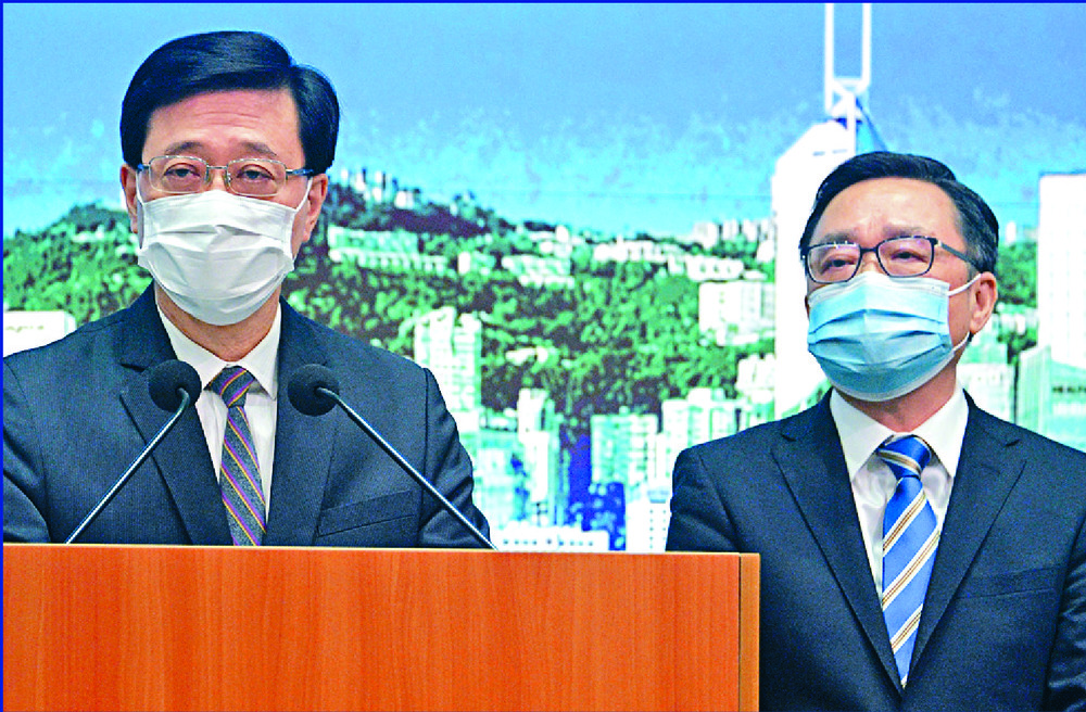 John Lee, left, and Cheng Kam-chung of the Fight Crime Committee. SING TAO John Lee, left, and Cheng Kam-chung of the Fight Crime Committee. SING TAO
