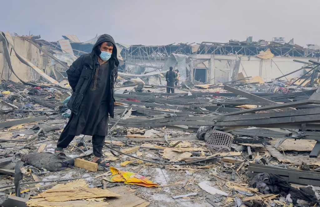 A man walks at the site of a drug users rehabilitation hospital destroyed in what the Taliban said was a Pakistani air strike in Kabul, Afghanistan, March 17, 2026. REUTERS/Sayed Hassib