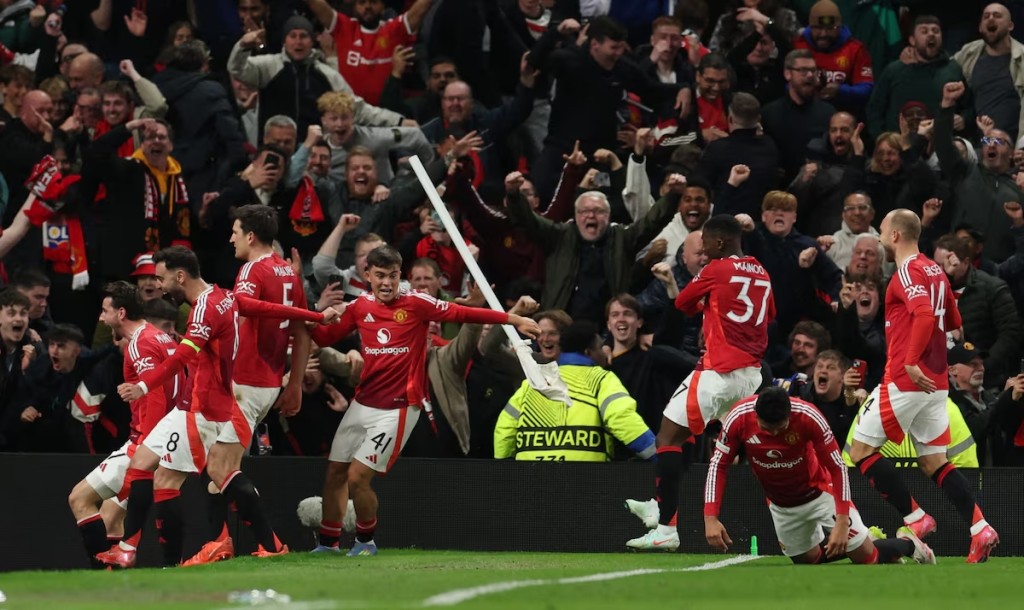  Manchester United's Harry Maguire celebrates scoring their fifth goal with teammates. (Reuters)