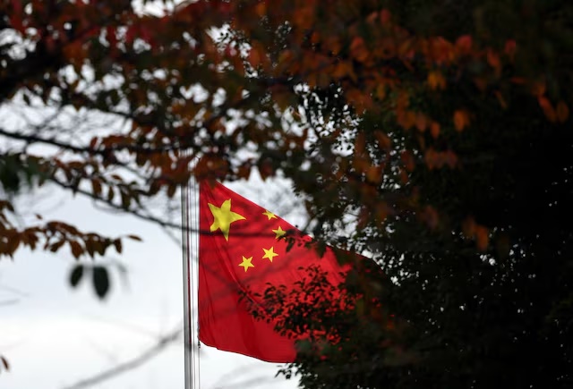 A Chinese national flag is hoisted at the Chinese embassy in Tokyo, Japan November 18, 2025. REUTERS/Issei Kato 