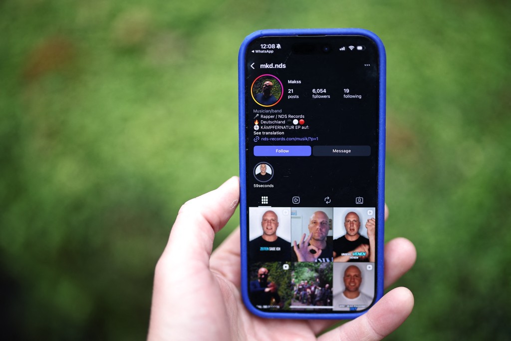 Photo by - / AFP  The Instagram page of MaKss Damage, a German rapper, is displayed for a photograph on a smartphone in London on October 28, 2025.