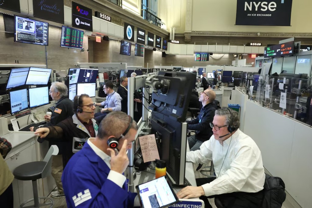 Futures-options traders work on the floor at the New York Stock Exchange's NYSE American (AMEX) in New York City, U.S., January 6, 2026. REUTERS