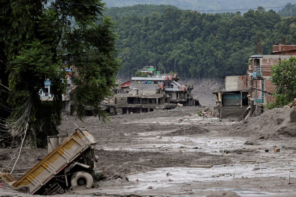 Mud covers houses and a road following a flash flood at Trishuli in Nuwakot district, Nepal, August 26. REUTERS/Navesh Chitrakar