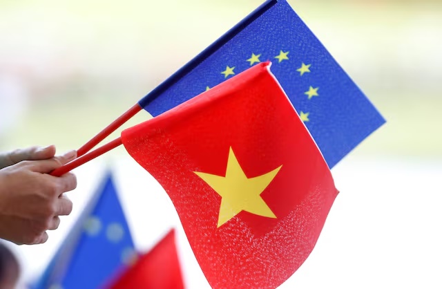 European Union and Vietnamese flags are seen at the government office in Hanoi, Vietnam June 30, 2019. REUTERS/Kha/ File Photo