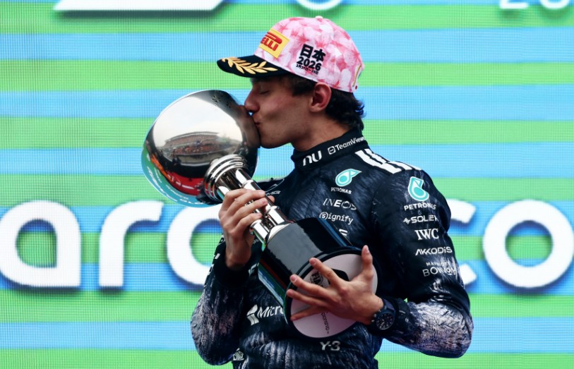 Kimi Antonelli kisses the trophy after winning the Japanese Grand Prix at Suzuka. REUTERS