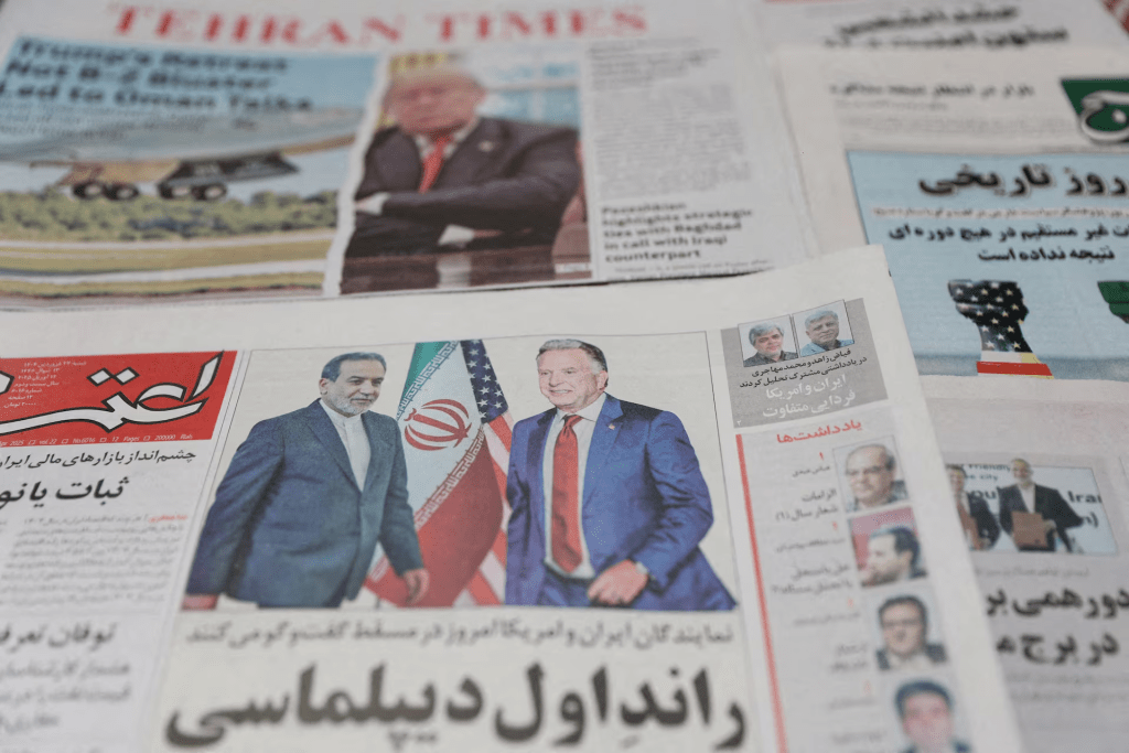 An Iranian newspaper with a cover photo of Iran's Foreign Minister Abbas Araqchi and U.S. Middle East envoy Steve Witkoff, is seen in Tehran, Iran, April 12, 2025. Majid Asgaripour/WANA (West Asia News Agency) via REUTERS/File Photo