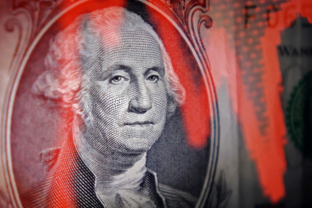 U.S. dollar banknote and stock graph are seen in this illustration taken April 25, 2025. REUTERS/Dado Ruvic/Illustration