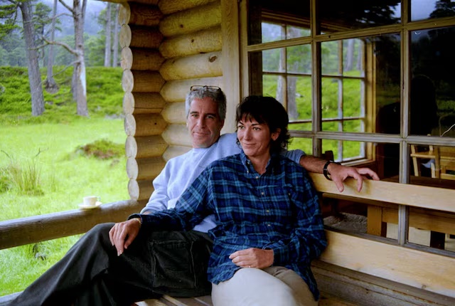 Ghislaine Maxwell and Jeffrey Epstein are seen in this image released by the Department of Justice in Washington, D.C., U.S., on December 19, 2025 as part of a new trove of documents from its investigations into the late financier and convicted sex offender Jeffrey Epstein. U.S. Justice Department/Handout via REUTERS/File Photo