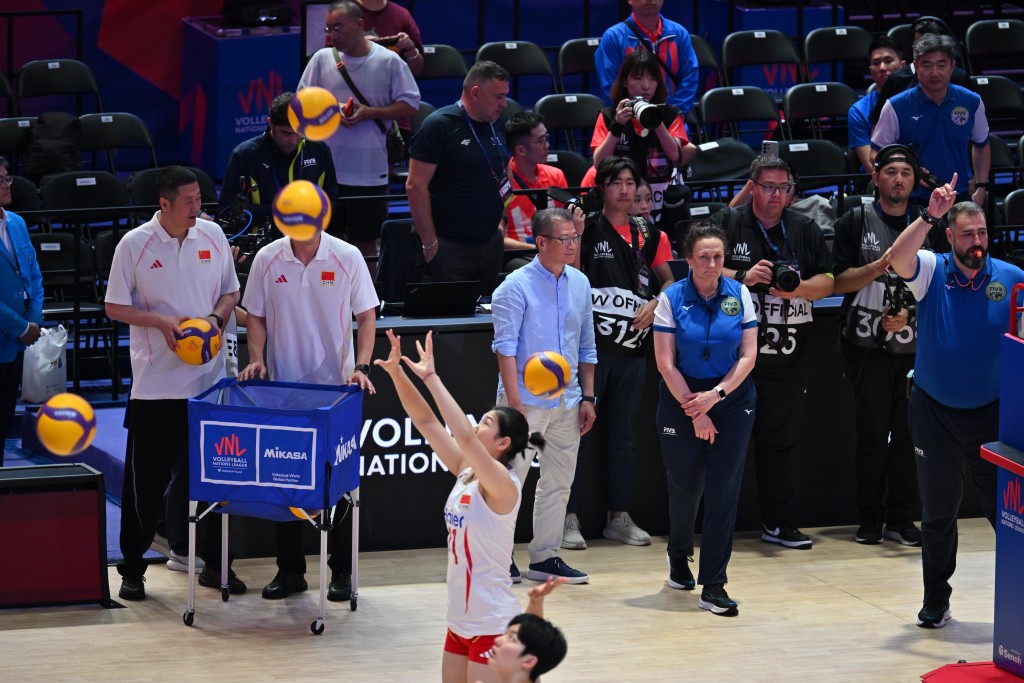 inancial Secretary Paul Chan officiating the coin toss