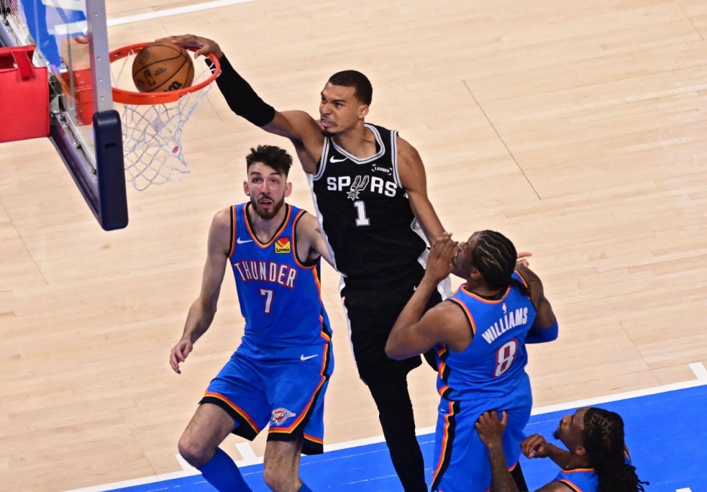 Victor Wembanyama scores on a dunk. AFP