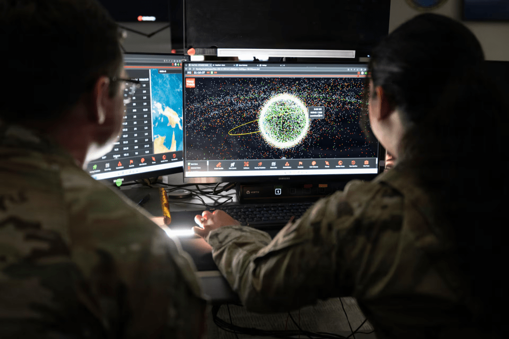 Militaries now view satellites as weapons systems, amid mounting space threats. U.S. Space Force personnel monitor orbital operations from a military base in California in December. U.S. Space Forces/David Dozoretz/Handout via REUTERS