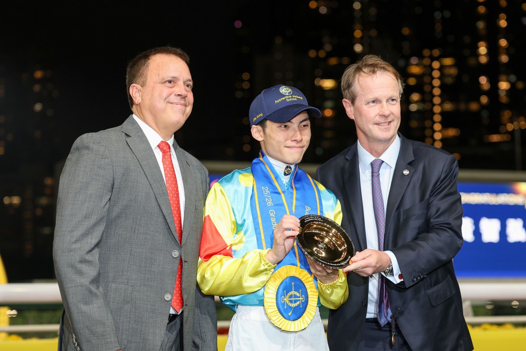 Caspar Fownes, Ellis Wong and Andrew Harding after Wong graduated from his apprenticeship with his 70th Hong Kong winner. HKJC
