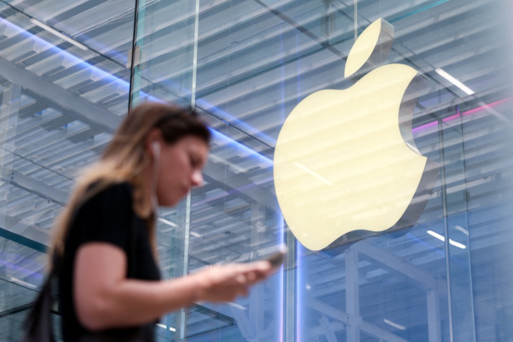 FILE PHOTO: A person walks by the Apple store on Fifth Avenue in New York City, U.S., May 1, 2025. REUTERS/Kylie Cooper/File Photo