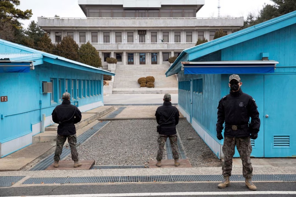 FILE PHOTO: South Korean soldiers stand guard during a media tour at the Joint Security Area (JSA) on the Demilitarized Zone (DMZ) in the border village of Panmunjom in Paju, South Korea, 03 March 2023. JEON HEON-KYUN/Pool via REUTERS/File Photo/File Photo