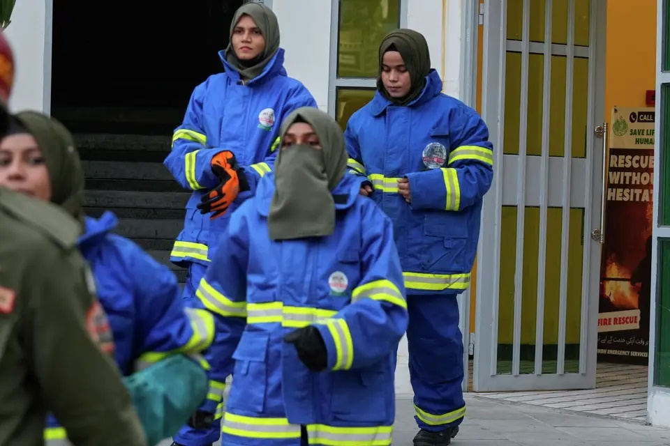 Female firefighter Syeda Masooma Zaidi, right back, arrives with her team members to attend a routine training session, at the compound of their office in Karachi, Pakistan, Friday, Oct. 10, 2025. Fareed Khan/AP
