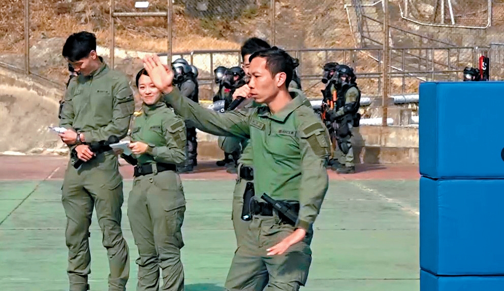 Officers showcase applications of Tai Chi Safe Defense Techniques during the opening ceremony.