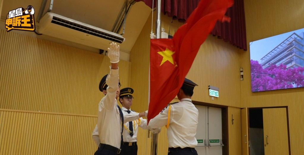 During the flag-raising ceremony, the students were solemn and serious.