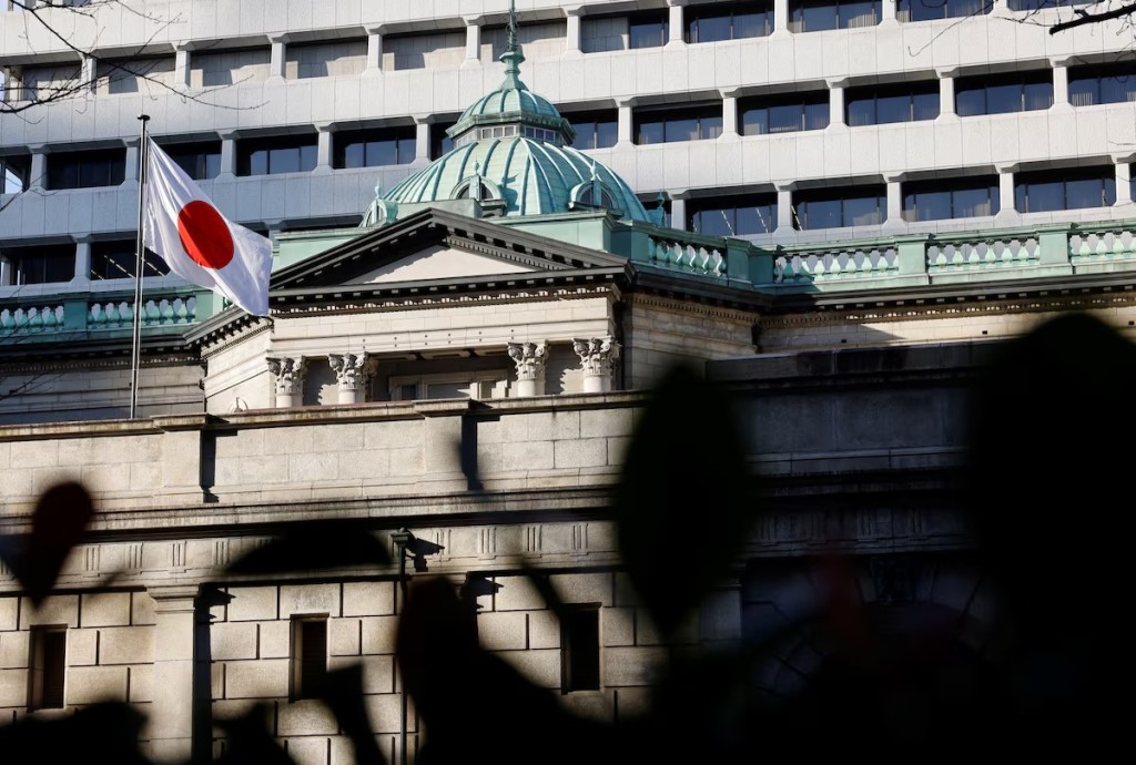 A Japanese flag flutters atop the Bank of Japan headquarters in Tokyo, Japan December19, 2025. REUTERS