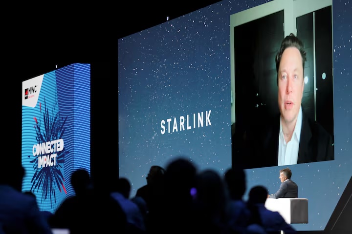 SpaceX founder and Tesla CEO Elon Musk speaks on a screen during the Mobile World Congress (MWC) in Barcelona, Spain, June 29, 2021. REUTERS/Nacho Doce/File Photo