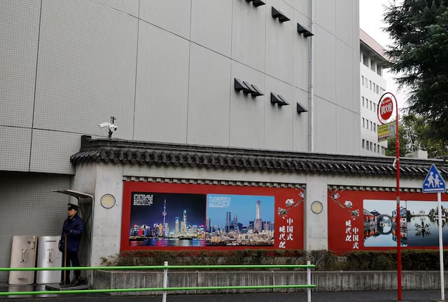 A Japanese police officer stands guard in front of the Chinese Embassy in Tokyo, Japan, March 25, 2026. REUTERS/Kim Kyung-Hoon