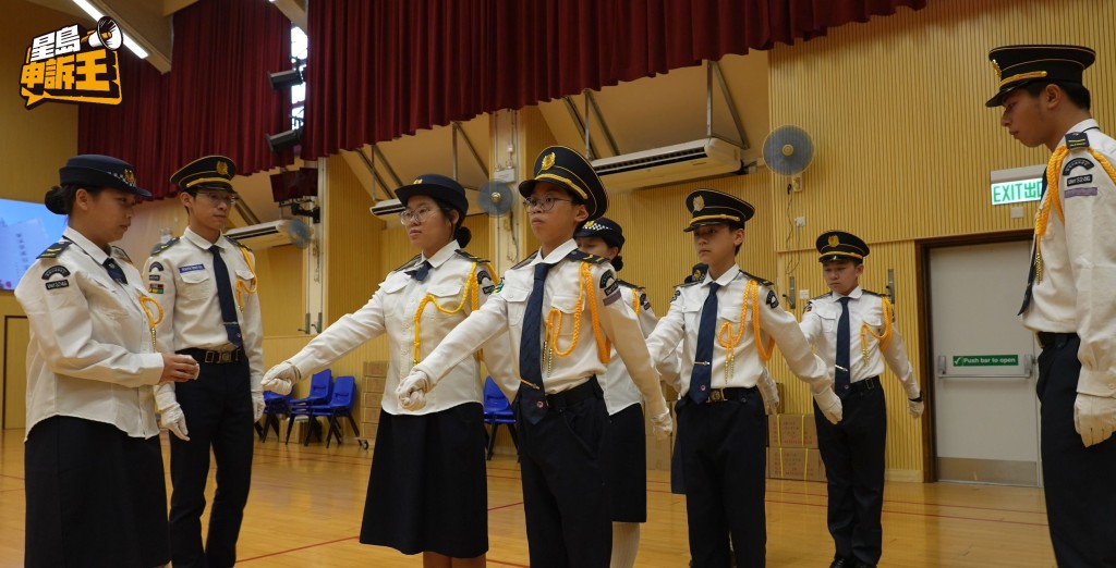During the flag-raising ceremony, the students were solemn and serious.