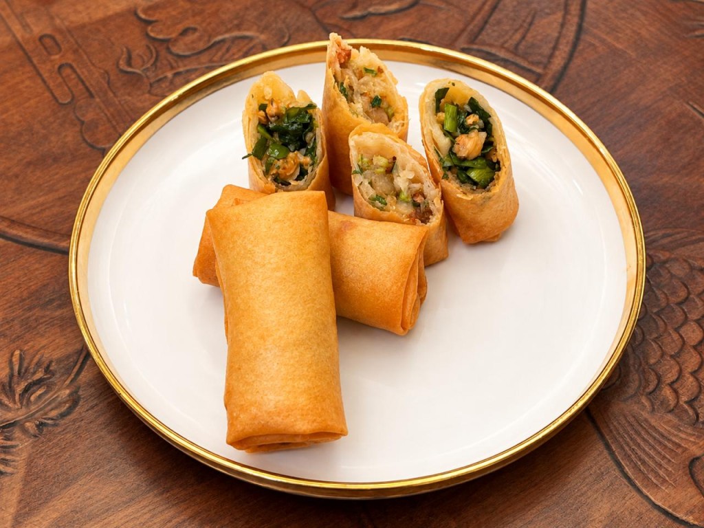 Ho Ho Chak's Chiu Chow-inspired spring rolls - reinterpretation of Chiu Chow flavors, combining chive-and-clam stir-fry with a fun gor-style filling wrapped in a crisp spring roll.