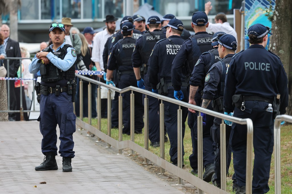 Photo by DAVID GRAY / AFP The police search for evidence around the area where the Bondi Beach shooting took place in Sydney on December 16, 2025.