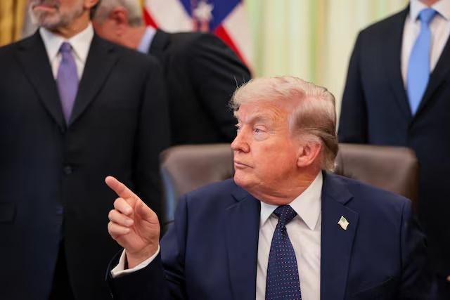 U.S. President Donald Trump points a finger as he participates in a healthcare affordability event in the Oval Office at the White House in Washington, D.C., U.S., April 23, 2026. REUTERS/Kylie Cooper