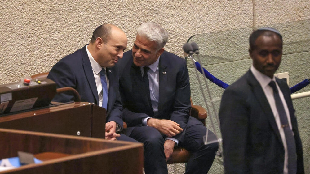 Israeli Prime Minister Nafatali Bennett and Foreign Minister Yair Lapid speak in parliament. (AFP) Israeli Prime Minister Nafatali Bennett and Foreign Minister Yair Lapid speak in parliament. (AFP)