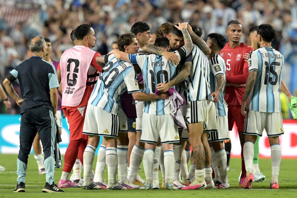 Argentina's players celebrate after winning the 2026 World Cup football tournament quarter-final match between Argentina and Switzerland. (AFP)