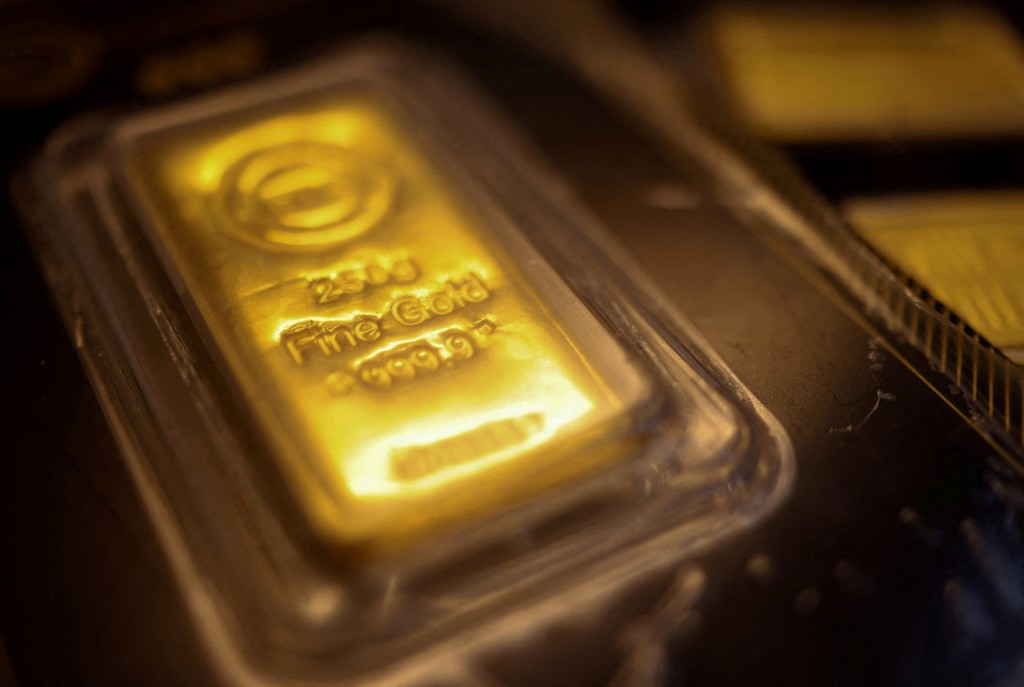 A gold bar marked with the letters "BTC" (out of focus) is displayed at a jewellery shop at the Al Moez Street gold market in Old Cairo as demand for gold bars and coins rises in Egypt, with buyers seeking a safer store of value amid volatile markets and economic uncertainty, traders and industry officials said, in Cairo, Egypt, February 5, 2026. REUTERS/Amr Abdallah Dalsh