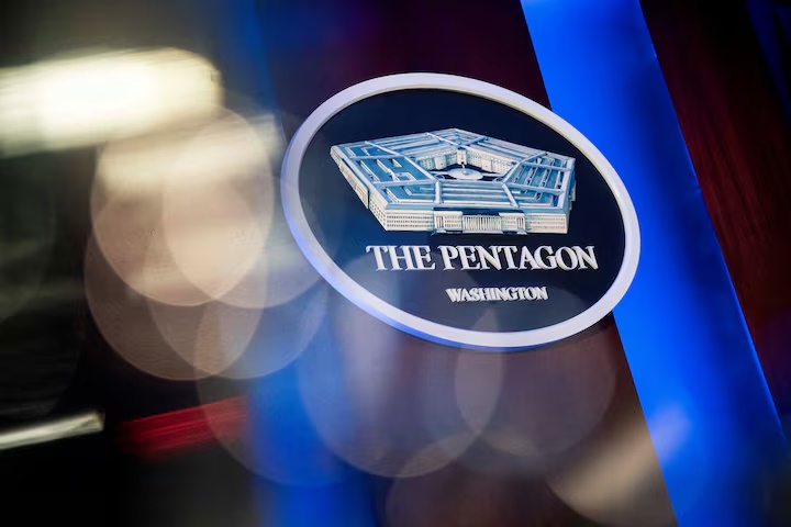 The Pentagon logo is seen behind the podium in the briefing room at the Pentagon in Arlington, Virginia, U.S., January 8, 2020. REUTERS/Al Drago/File Photo